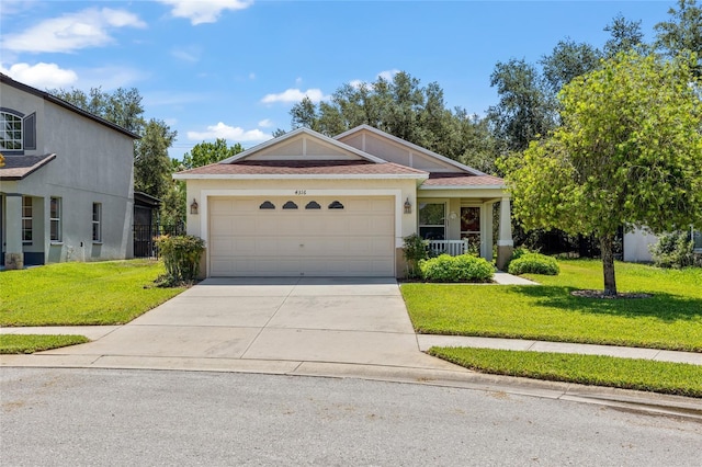 view of front of home featuring a garage and a front yard