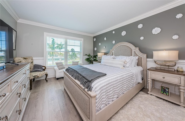 bedroom with crown molding and light wood-type flooring