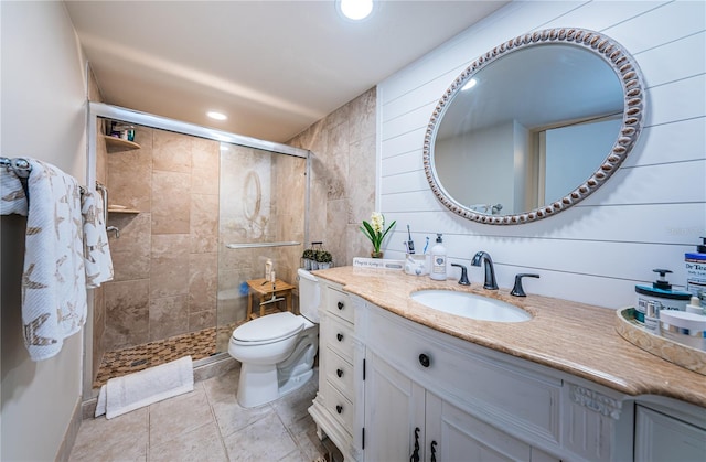 bathroom featuring vanity, toilet, and an enclosed shower