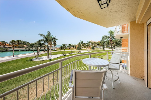 balcony featuring a water view