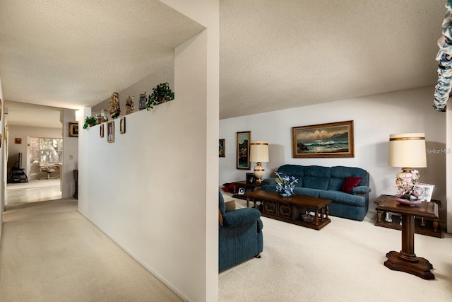 carpeted living room featuring a textured ceiling