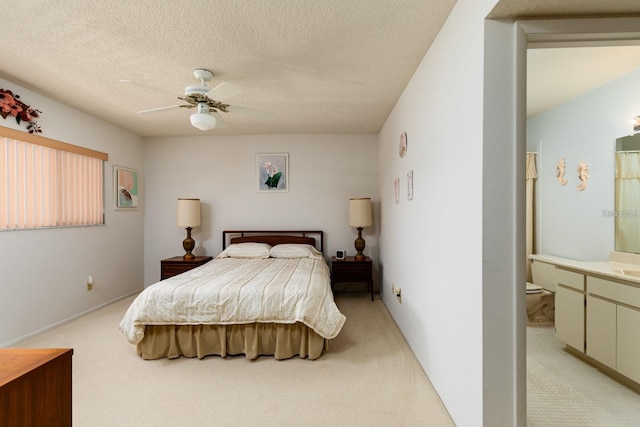 carpeted bedroom featuring ceiling fan and a textured ceiling