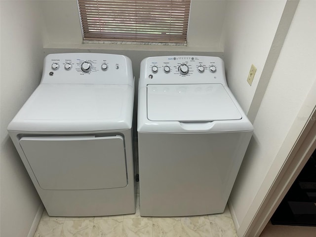 laundry area with independent washer and dryer