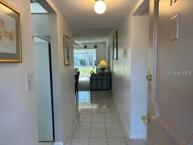 hallway featuring a textured ceiling