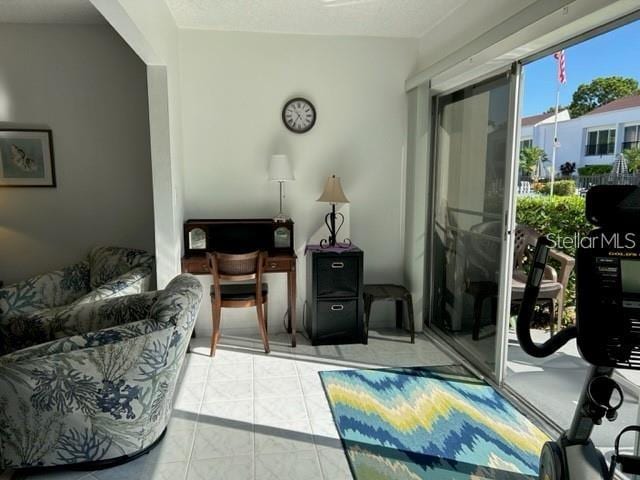 sitting room featuring light tile patterned flooring