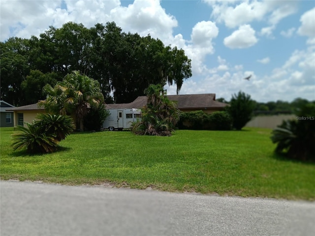 ranch-style house with a front yard