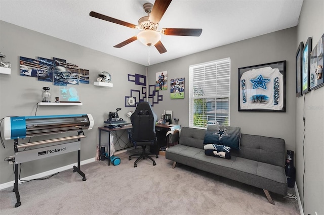 carpeted office featuring ceiling fan