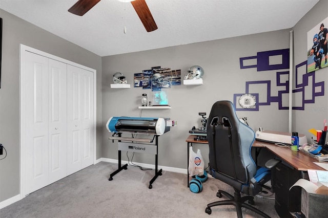 home office featuring carpet floors and ceiling fan