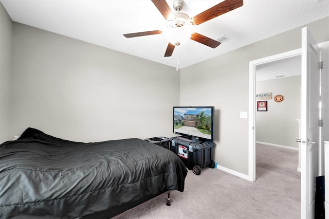 bedroom with ceiling fan and light colored carpet