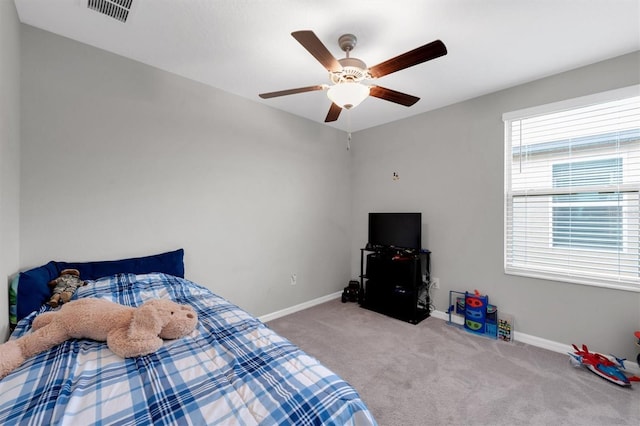 bedroom featuring ceiling fan and light carpet