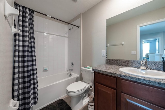 full bathroom featuring vanity, toilet, and shower / tub combo