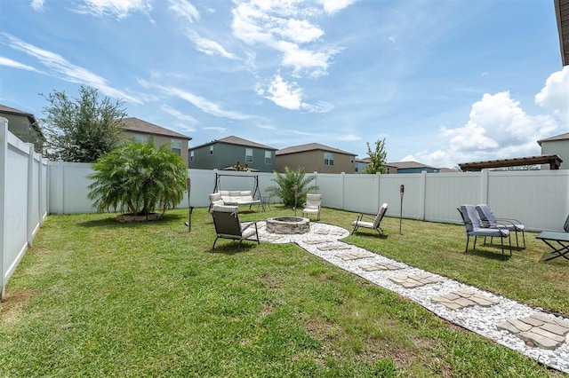 view of yard with an outdoor fire pit