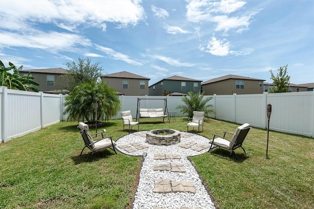 view of yard featuring an outdoor fire pit