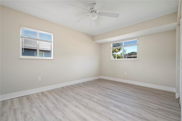 empty room featuring light hardwood / wood-style flooring and ceiling fan