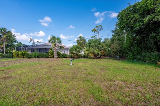 view of yard with a lanai