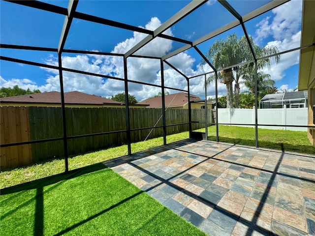 view of patio / terrace with a lanai