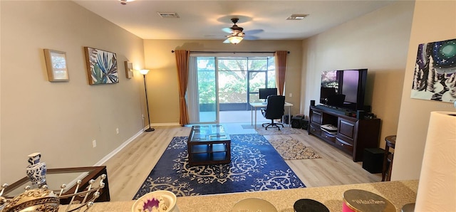 living room featuring ceiling fan and light wood-type flooring