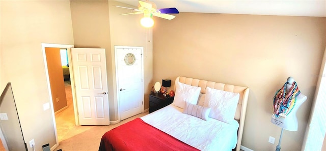 carpeted bedroom featuring lofted ceiling