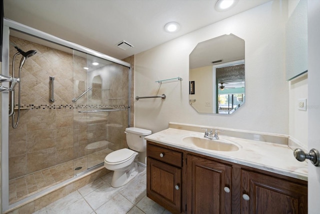 bathroom with tile patterned floors, an enclosed shower, vanity, ceiling fan, and toilet