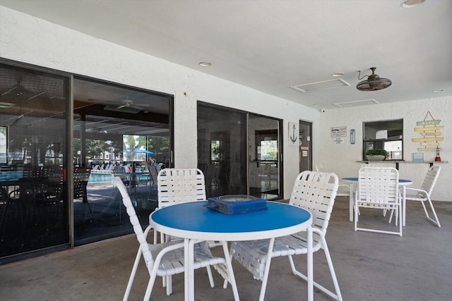 interior space with ceiling fan