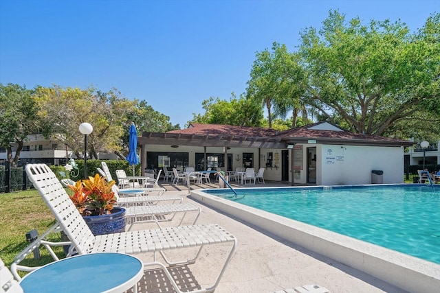 view of swimming pool with a patio