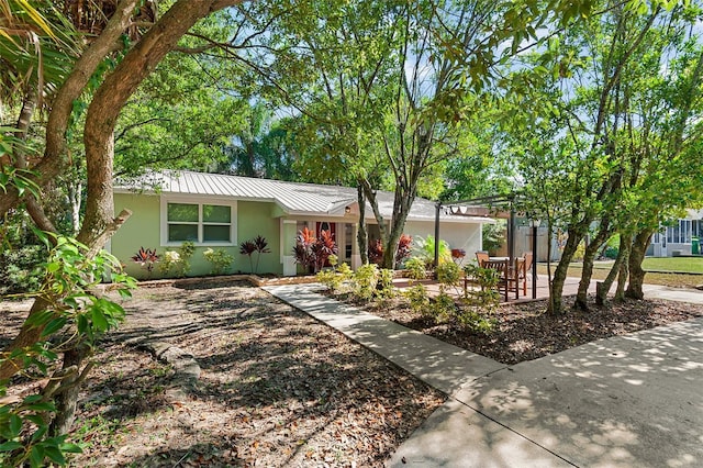 single story home featuring a patio area