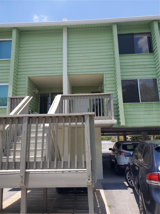 318 Windrush Blvd Unit 9, Indian Rocks Beach, FL 33785 - back of house with covered parking