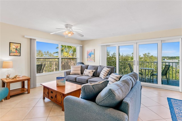 living room with ceiling fan and light tile patterned floors