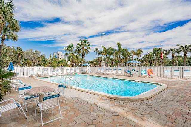 view of swimming pool featuring a patio