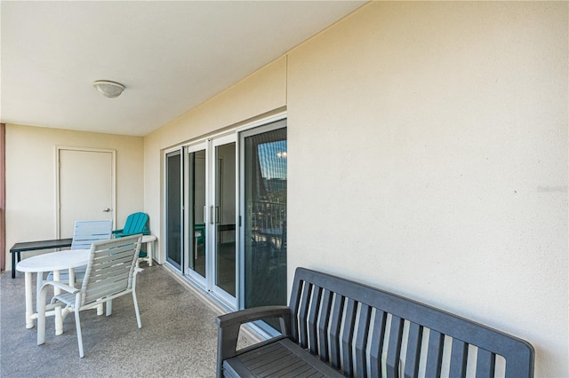 balcony featuring a patio and french doors