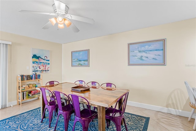 dining area with ceiling fan and light tile patterned flooring