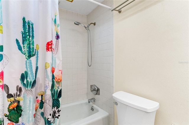 bathroom featuring toilet and shower / bath combo with shower curtain