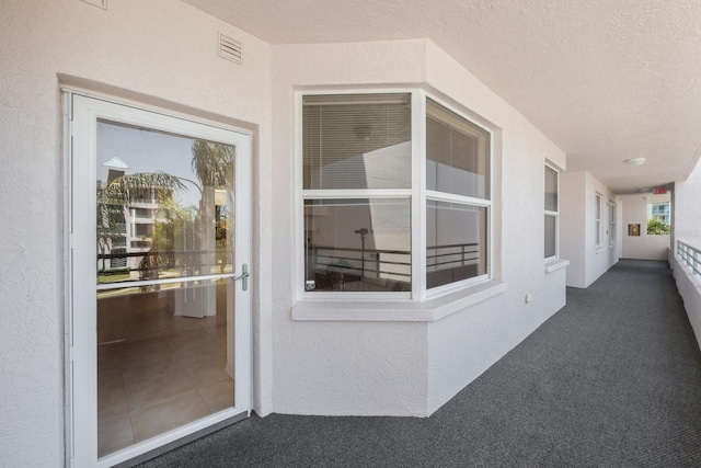 property entrance with a balcony