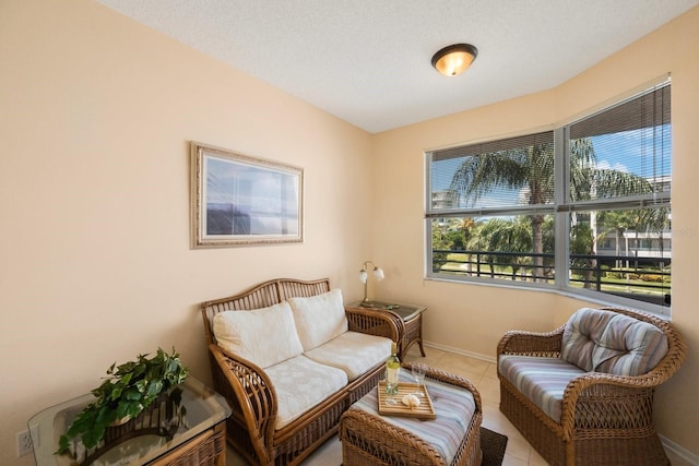 sitting room featuring light tile patterned floors and a textured ceiling