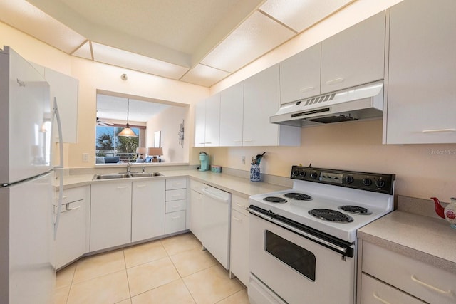 kitchen featuring sink, light tile patterned floors, white cabinets, and white appliances