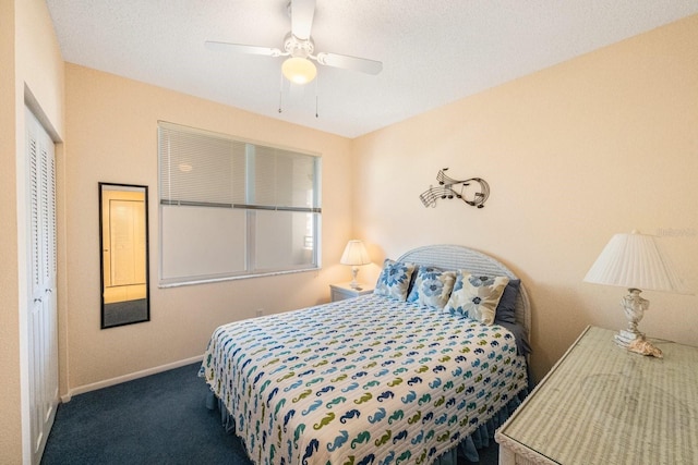 bedroom featuring carpet, ceiling fan, and a closet