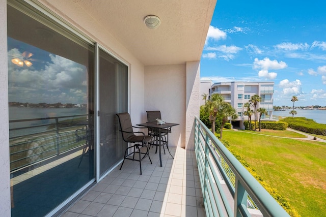 balcony featuring a water view