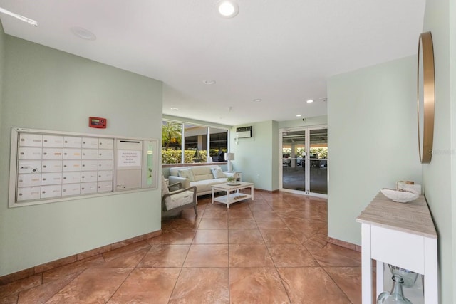 hall with light tile patterned floors, plenty of natural light, and mail boxes