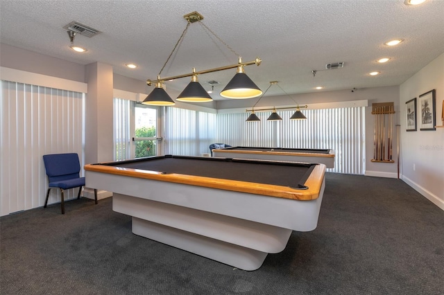 playroom with billiards, a textured ceiling, and dark colored carpet