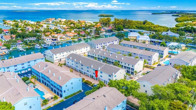 bird's eye view featuring a residential view and a water view