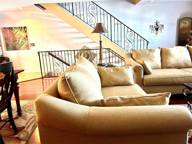 living room featuring stairway and wood finished floors