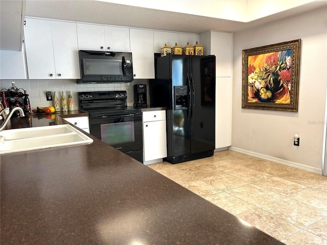 kitchen featuring a sink, white cabinets, backsplash, black appliances, and dark countertops