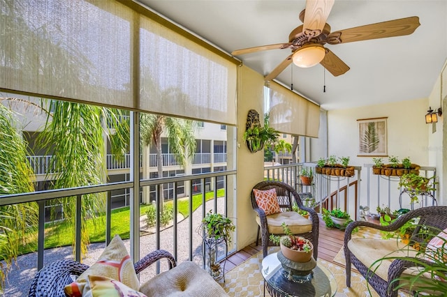 sunroom featuring ceiling fan