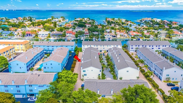 drone / aerial view with a residential view and a water view