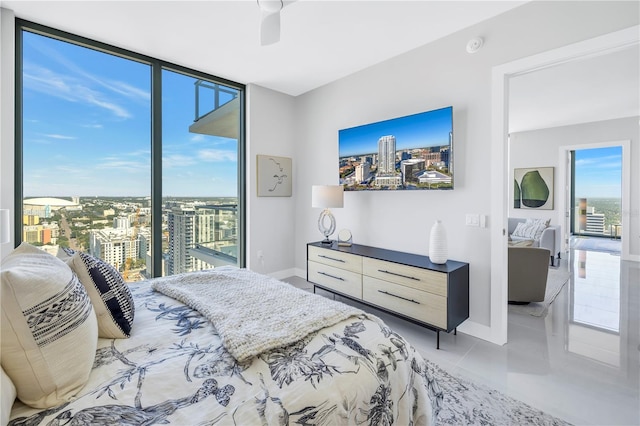 tiled bedroom with ceiling fan