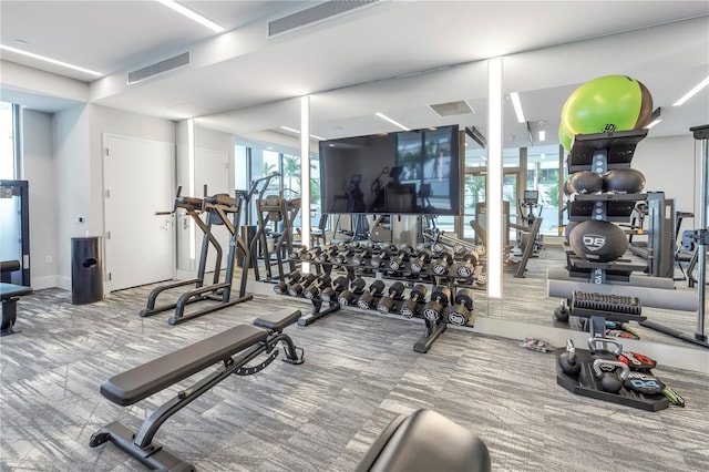 exercise room with carpet flooring