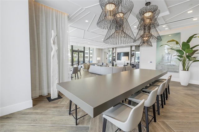 dining room with a notable chandelier and light hardwood / wood-style floors