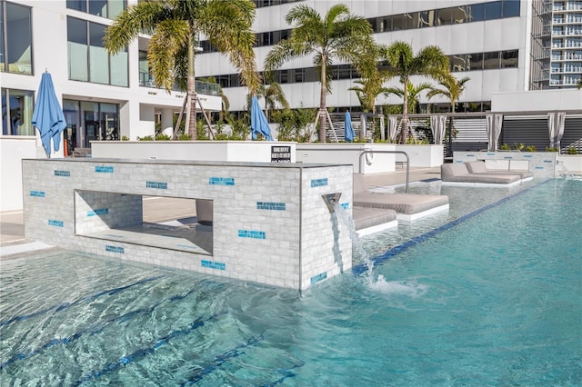 view of pool featuring pool water feature