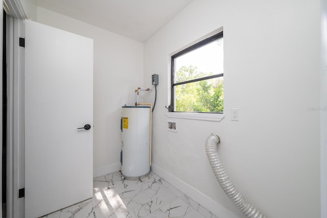 interior space with electric dryer hookup, hookup for a washing machine, and water heater