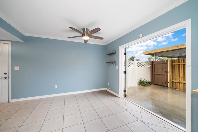 empty room with ornamental molding, ceiling fan, and light tile floors